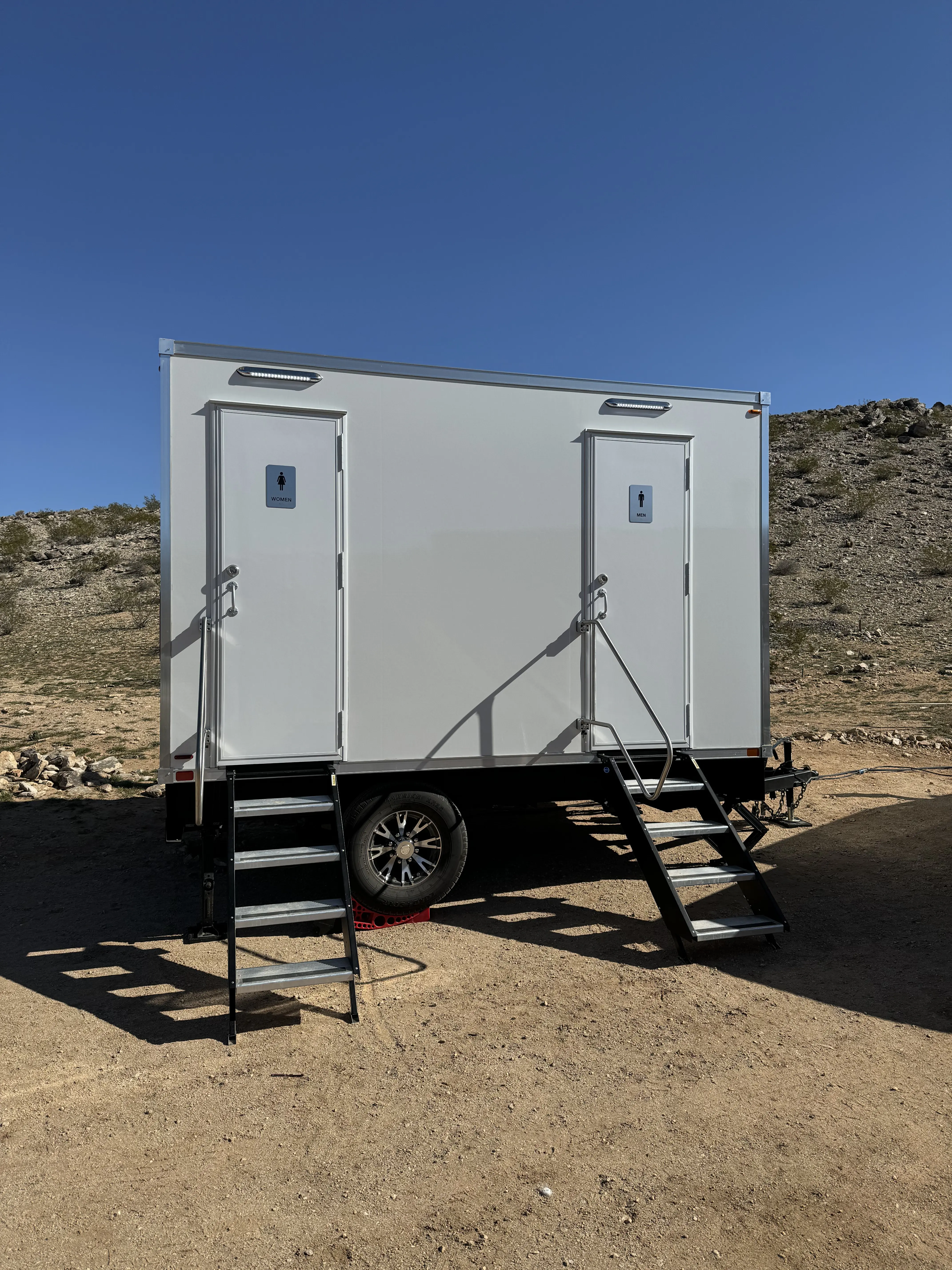 Front of portable luxury restroom trailer at an event in Joshua Tree, CA