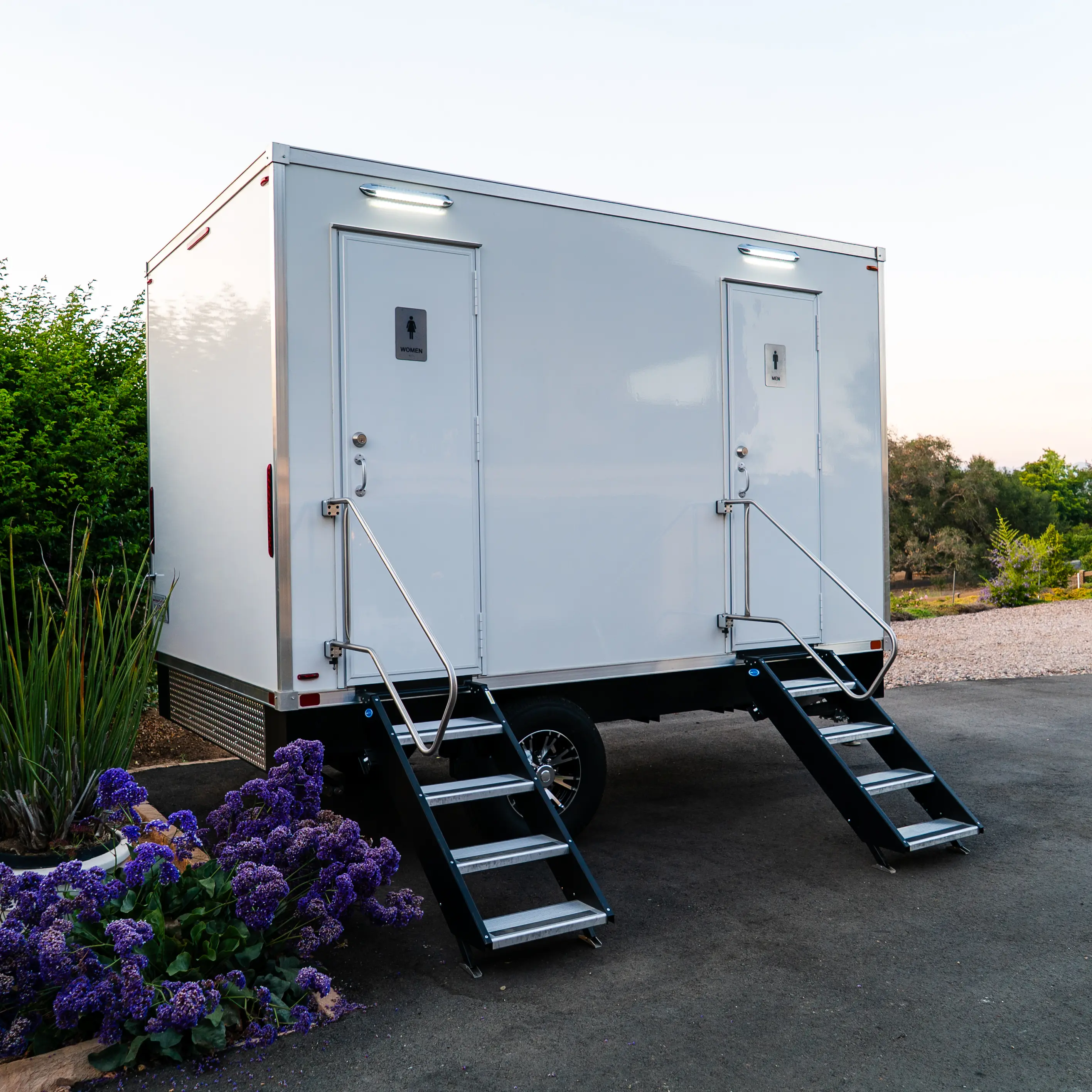 Left side view of the four station restroom trailer rental from VIP Rentals, LLC.