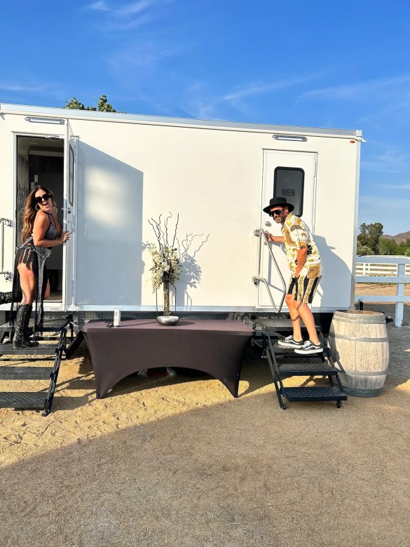 In Temecula, a man and a woman use each of the bathroom stations for a luxury restroom rental.