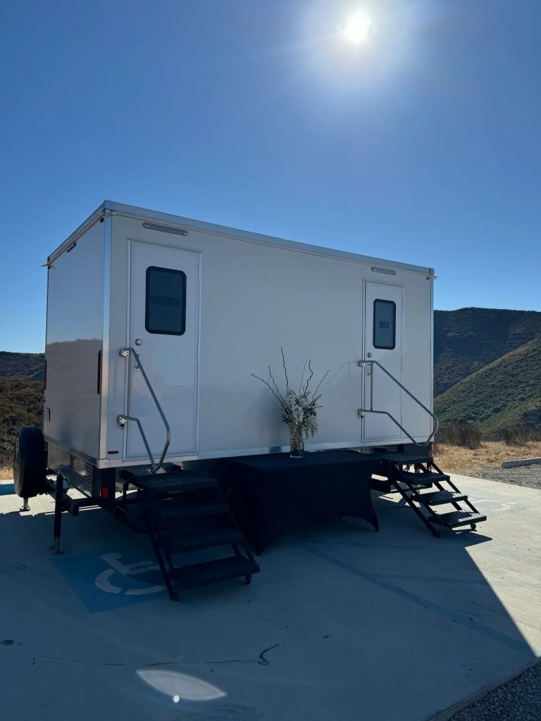 Luxury restroom trailer from VIP Rentals, LLC set up at an outdoor event in Malibu, California.
