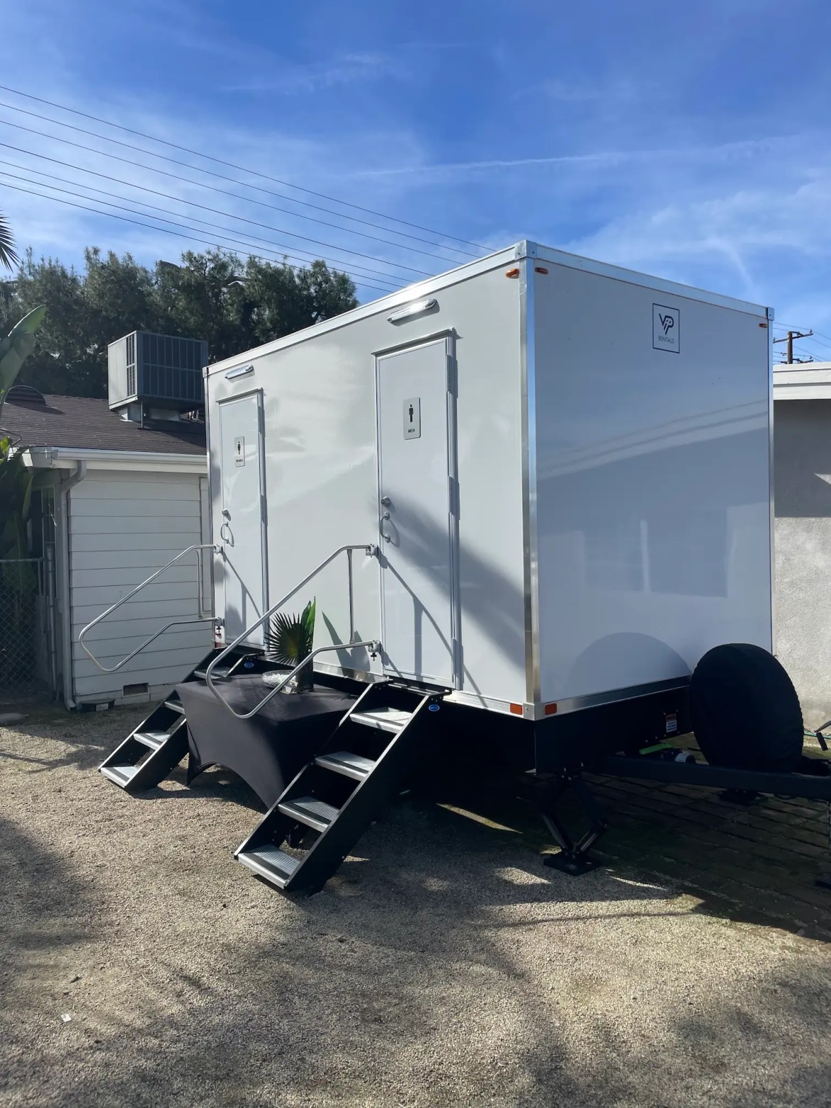 Side view of a VIP Rentals, LLC 4-station luxury bathroom trailer at a birthday party in Riverside County, CA.